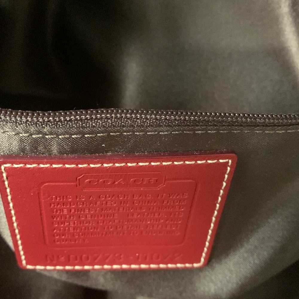 Coach large purse without tags. It is 13/1/2inches wide and 9” depth.